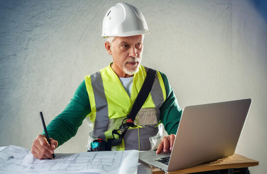 Constructor working with CAD software for earthmoving Constructor working with CAD software for earthmoving
